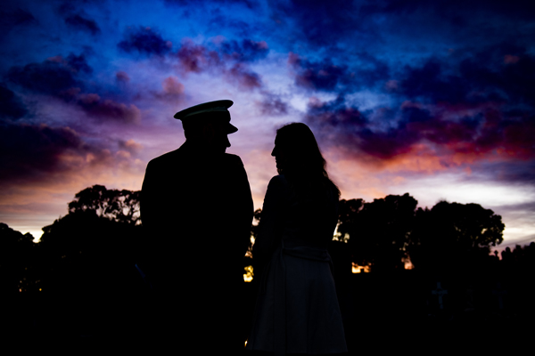 Silhouettes of a man and a woman in the dawn light