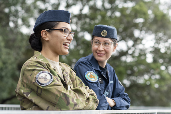 Two female NZDF personnel talking and smiling