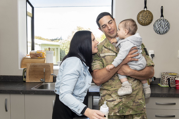 NZDF member with his partner and baby